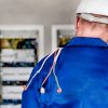 Electrician working on electric panel