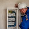 Electrician looking at panel